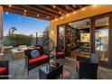 Inviting outdoor patio with cozy seating, a fire pit, and string lights for ambiance at 924 E Whitton Ave, Phoenix, AZ 85014