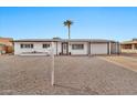 Inviting single-story home with well-kept desert landscaping and convenient covered parking at 934 S Roslyn Pl, Mesa, AZ 85208