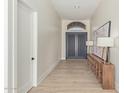 Light and airy foyer with wood-look floors and stylish console table at 11743 E Desert Vista Dr, Scottsdale, AZ 85255