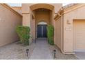 Inviting front entrance with a paved walkway, desert landscaping and covered porch at 11743 E Desert Vista Dr, Scottsdale, AZ 85255
