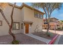 Inviting home with desert landscaping, a covered entry, and multiple windows at 1225 N 36Th St # 2091, Phoenix, AZ 85008