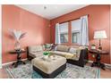 Cozy living room with a large sectional sofa and stylish decor at 1225 N 36Th St # 2091, Phoenix, AZ 85008
