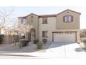 Charming two-story home with landscaped front yard, archway entrance, and a two car garage at 1349 E Dunbar Dr, Phoenix, AZ 85042
