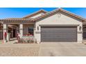Charming single-Gathering home with a two-car garage, covered porch, and low-maintenance landscaping at 1366 W Santa Gertrudis Trl, San Tan Valley, AZ 85143