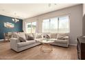 Inviting living room offering comfortable seating, large window, and dining area with stylish decor at 1941 W Trotter Trl, Phoenix, AZ 85085