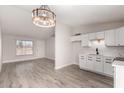 Open-concept floor plan with updated lighting and new floors, great for entertaining at 3120 N 67Th Ln # 96, Phoenix, AZ 85033