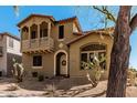 Inviting two-story home boasts a balcony and low-maintenance desert landscaping at 32405 N 23Rd Ave, Phoenix, AZ 85085