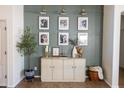 Elegant entryway featuring a stylish console table, decorative wall art, and neutral color palette at 41250 W Thornberry Ln, Maricopa, AZ 85138