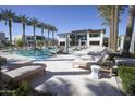 Inviting pool area with lounge chairs and palm trees at The Ritz-Carlton Residences, Paradise Valley at 6587 N Palmeraie Blvd # 2041, Paradise Valley, AZ 85253