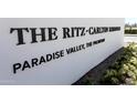 Close-up of The Ritz-Carlton Residences, Paradise Valley, The Palmerae sign on a white wall at 6587 N Palmeraie Blvd # 2041, Paradise Valley, AZ 85253