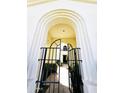 Inviting gated entryway with archway leads into a private courtyard oasis at 7667 E Krall St, Scottsdale, AZ 85250