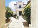 Charming two-story home featuring a balcony and a lush landscaped yard at 7667 E Krall St, Scottsdale, AZ 85250