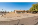 Single story home featuring low maintenance landscaping with a covered carport and quaint porch at 8648 N 37Th Ave, Phoenix, AZ 85051