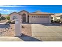 Charming single-story home featuring a well-maintained yard and a two-car garage at 9437 E Champagne Dr, Sun Lakes, AZ 85248