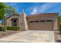 Stunning single-story home featuring a desert landscape and a two-car garage with ample parking at 12098 W Lone Tree Trl, Peoria, AZ 85383
