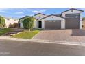 Attractive single-Gathering home with a three-car garage and well-maintained desert landscaping at 12539 W Tuckey Ln, Glendale, AZ 85307
