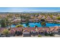 Stunning aerial view of waterfront homes with a beautiful lake and mountain backdrop at 1470 S Villas Ct, Chandler, AZ 85286