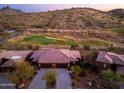 Aerial view of a home nestled in a golf community with scenic mountain views at 16341 E Links Dr, Fountain Hills, AZ 85268