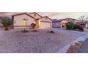 Well maintained single-Gathering home with desert landscaping and a two car garage at 2225 E Andalusian Loop, San Tan Valley, AZ 85140