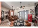 Comfortable living room with ample natural light, cozy furnishings, and a vintage-style Coca-Cola refrigerator at 36249 N 7Th St, Phoenix, AZ 85086