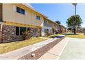 Inviting street view of townhomes with landscaped walkways and mature trees at 4003 S Mill Ave, Tempe, AZ 85282