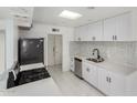 A bright kitchen boasts new countertops, stainless steel appliances, and updated cabinets and hardware at 6767 N 7Th St # 212, Phoenix, AZ 85014