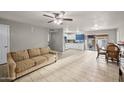 Bright living room flows into an open kitchen with updated appliances and ample counter space at 907 N Menze St, Casa Grande, AZ 85122