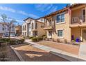 Desirable two-story townhome displaying a balcony, neat yard, and convenient walkway at 925 S Storment Ln, Gilbert, AZ 85296