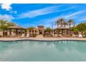 Community pool featuring poolside lounge areas, cabanas, and meticulously landscaped grounds for luxurious outdoor living at 925 S Storment Ln, Gilbert, AZ 85296
