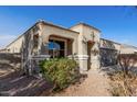 Charming single-story home with low-maintenance desert landscaping and a two-car garage at 11230 E Cliffrose Ln, Florence, AZ 85132