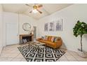 Inviting living room features a brick fireplace, stylish furniture, and modern decor, creating a cozy atmosphere at 14224 N 26Th Ln, Phoenix, AZ 85023