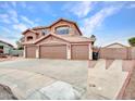 Charming home featuring a three-car garage, neutral paint, and low-maintenance desert landscaping at 15819 W Ripple Rd, Goodyear, AZ 85338