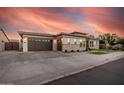 Spacious three-car garage with a convenient side entrance and brick-paved driveway at 1925 E La Costa Dr, Gilbert, AZ 85298