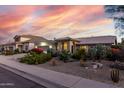 Beautiful Southwestern home featuring desert landscaping, including cacti and gravel, under a colorful sky at 2169 E Alameda Dr, Tempe, AZ 85282