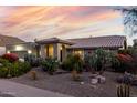 Inviting desert-landscaped home with mature cacti and gravel landscaping complemented by a stunning sunset at 2169 E Alameda Dr, Tempe, AZ 85282