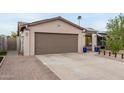 Exterior shot of a home's attached two-car garage and driveway at 2744 E Windrose Dr, Phoenix, AZ 85032