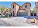 Inviting two-story home with stone accents, a two-car garage, and a well-manicured front yard at 3443 S California St, Chandler, AZ 85248