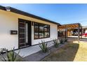 Close-up of the home's front entrance, showcasing modern design and curb appeal at 3707 E Amelia Ave, Phoenix, AZ 85018