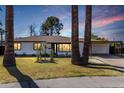 Beautiful home with a well-manicured lawn and covered carport, perfect for outdoor living at 3707 E Amelia Ave, Phoenix, AZ 85018