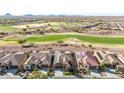 Stunning aerial view of the community, highlighting its lush golf course and well-maintained homes at 3942 N San Marin Dr, Florence, AZ 85132