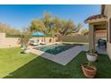 Sparkling pool with lounge chairs and a covered patio at 39526 N White Tail Ln, Anthem, AZ 85086