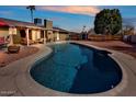 Inviting pool with lounge area creating an ideal outdoor retreat for summer days and relaxation at 4201 W Brown St, Phoenix, AZ 85051