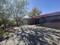 Exterior view of the home showcasing its charming architectural design and desert surroundings at 6528 N Hillside Dr, Paradise Valley, AZ 85253