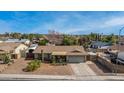 Single-story home with a large front yard and mature trees in a suburban neighborhood at 947 N Saffron --, Mesa, AZ 85205