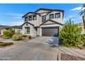 Charming two-story home featuring a two-car garage and a well-maintained front yard at 9759 E Satellite Dr, Mesa, AZ 85212