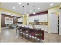 Open-concept kitchen with granite countertops, stainless steel appliances, and a view into the dining area at 10049 E Topaz Ave, Mesa, AZ 85212