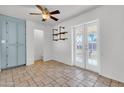 Bright dining area with tile floors, ceiling fan, and access to the backyard at 1007 W 5Th St, Mesa, AZ 85201