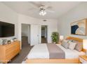 Comfortable bedroom with ceiling fan, TV and ample closet space at 10410 N Cave Creek Rd # 2119, Phoenix, AZ 85020