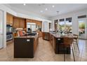 Spacious kitchen with stainless steel appliances, granite countertops, and tile flooring at 10886 E Ludlow Dr, Scottsdale, AZ 85255