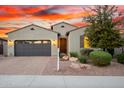 Charming single-Gathering home with a well-manicured front yard and a two-car garage at 12924 W Caraveo Pl, Peoria, AZ 85383